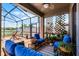 Relaxing screened-in patio area featuring comfortable seating and a hammock for lounging at 3420 Middlebrook Pl, Harmony, FL 34773