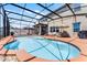 Stunning pool with an open-air screened lanai, multiple seating areas, and backyard views at 3420 Middlebrook Pl, Harmony, FL 34773