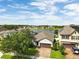 Aerial view of the home showcasing its landscaping and proximity to the water at 3424 Middlebrook Pl, Harmony, FL 34773