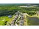 Aerial perspective of homes in a community with ponds, golf course, and extensive green spaces at 3424 Middlebrook Pl, Harmony, FL 34773