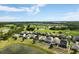 Scenic aerial view overlooking the community, showcasing the golf course, ponds, and lush greenery at 3424 Middlebrook Pl, Harmony, FL 34773
