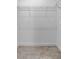 A walk-in closet featuring wire shelving and durable flooring at 3424 Middlebrook Pl, Harmony, FL 34773