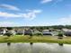 Scenic view of the community with homes and a pond in the background at 3424 Middlebrook Pl, Harmony, FL 34773