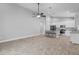 Open-concept living area and modern kitchen design with ample counter space at 3424 Middlebrook Pl, Harmony, FL 34773