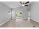 Bright living room with sliding glass doors offering a view of the fenced-in backyard at 3424 Middlebrook Pl, Harmony, FL 34773