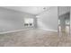 Bright, airy living room with tile flooring and ample natural light from a large window at 3424 Middlebrook Pl, Harmony, FL 34773