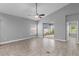 Bright, open living room with sliding glass doors leading to the outdoor space at 3424 Middlebrook Pl, Harmony, FL 34773