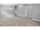 Spacious living area with tile floors, neutral gray walls and high ceilings at 3424 Middlebrook Pl, Harmony, FL 34773