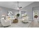 Cozy living room with stylish furnishings, natural light, and access to the patio at 3424 Middlebrook Pl, Harmony, FL 34773