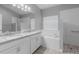 This is a main bathroom with double sinks, granite countertop, shower and soaking tub at 3424 Middlebrook Pl, Harmony, FL 34773