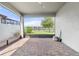 Covered patio featuring brick flooring with a scenic view of the backyard and lake at 3424 Middlebrook Pl, Harmony, FL 34773