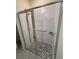 Bathroom featuring modern shower with glass door and neutral tile at 3476 Yarian Dr, Haines City, FL 33844