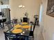Bright dining room featuring a glass-top table, stylish chairs, and decorative accents at 3476 Yarian Dr, Haines City, FL 33844