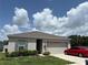 Well maintained home with a neutral color scheme, landscaping and a two-car garage at 3476 Yarian Dr, Haines City, FL 33844
