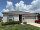 Well maintained home with a neutral color scheme, landscaping and a two-car garage at 3476 Yarian Dr, Haines City, FL 33844