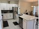 Spacious kitchen island featuring stainless steel appliances, and granite countertops at 3476 Yarian Dr, Haines City, FL 33844