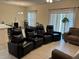Comfortable living room with theater seating, neutral tones, and natural light at 3476 Yarian Dr, Haines City, FL 33844