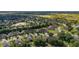 Aerial view of a community filled with homes, trees and landscaping at 3606 Solana Cir, Clermont, FL 34711