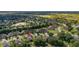 Aerial view of a community filled with homes, trees and landscaping at 3606 Solana Cir, Clermont, FL 34711