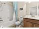 Well-maintained bathroom featuring a shower and tub, complemented by a stylish vanity and neutral decor at 3606 Solana Cir, Clermont, FL 34711