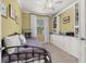 Cozy bedroom featuring a day bed, built-in bookshelves, and a window with natural light at 3606 Solana Cir, Clermont, FL 34711