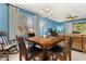 Cozy dining area featuring a wooden table with seating for four and a decorative chandelier at 3606 Solana Cir, Clermont, FL 34711