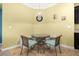 Cozy breakfast nook features banquette seating and a charming bistro table at 3606 Solana Cir, Clermont, FL 34711
