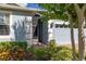 Exterior entrance featuring meticulous landscaping and a two-car garage at 3606 Solana Cir, Clermont, FL 34711
