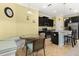 Bright kitchen with stainless appliances, granite counters, breakfast nook, and dark cabinets at 3606 Solana Cir, Clermont, FL 34711