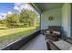 Inviting screened patio with comfortable wicker furniture overlooking a beautifully landscaped yard at 3606 Solana Cir, Clermont, FL 34711