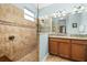 Bathroom featuring a walk-in shower with tiled walls and a glass enclosure at 3606 Solana Cir, Clermont, FL 34711