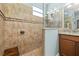 Tiled walk-in shower featuring a built-in seat and modern fixtures at 3606 Solana Cir, Clermont, FL 34711
