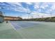 Well-maintained tennis courts offer a great recreational amenity with lush greenery and bright lighting for evening play at 3606 Solana Cir, Clermont, FL 34711