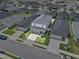 An aerial view showcases the property, adjacent homes, and neighborhood streets at 3926 Palazzo Pl, Winter Haven, FL 33884