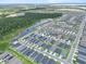 Aerial view showcases the property within a community with ponds and greenery at 3926 Palazzo Pl, Winter Haven, FL 33884