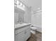 Clean bathroom with a single sink vanity, toilet and shower over tub combo at 3926 Palazzo Pl, Winter Haven, FL 33884