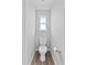 Modern toilet with a window to let in natural light at 3926 Palazzo Pl, Winter Haven, FL 33884