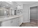 Bathroom featuring double sinks, modern fixtures, and a glass-enclosed shower at 3926 Palazzo Pl, Winter Haven, FL 33884