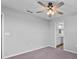 Bedroom featuring carpet, a ceiling fan and an ensuite bathroom at 3926 Palazzo Pl, Winter Haven, FL 33884