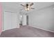 Bedroom with a ceiling fan, closet, and ensuite bathroom at 3926 Palazzo Pl, Winter Haven, FL 33884