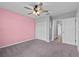 Bedroom with a ceiling fan, closet, and ensuite bathroom at 3926 Palazzo Pl, Winter Haven, FL 33884