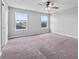 Large bedroom features two windows and neutral colored carpet at 3926 Palazzo Pl, Winter Haven, FL 33884