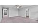 Spacious bedroom with neutral tones, ceiling fan, and access to an ensuite bathroom at 3926 Palazzo Pl, Winter Haven, FL 33884