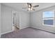 Cozy bedroom featuring a ceiling fan and a window that lets in natural light at 3926 Palazzo Pl, Winter Haven, FL 33884
