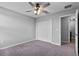 Bedroom featuring carpet, a ceiling fan and a double door closet at 3926 Palazzo Pl, Winter Haven, FL 33884