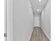 Hallway with a front door and modern flooring, creating a clean and welcoming atmosphere at 3926 Palazzo Pl, Winter Haven, FL 33884