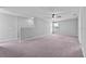 Large living room featuring plush carpet flooring and ceiling fan at 3926 Palazzo Pl, Winter Haven, FL 33884