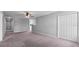 Spacious living room featuring neutral walls, carpet flooring and ceiling fan at 3926 Palazzo Pl, Winter Haven, FL 33884