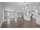 Spacious open-concept living space featuring a kitchen with white cabinets, and modern finishes at 3926 Palazzo Pl, Winter Haven, FL 33884