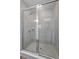 Modern tiled shower with a sleek glass enclosure and contemporary fixtures at 3926 Palazzo Pl, Winter Haven, FL 33884